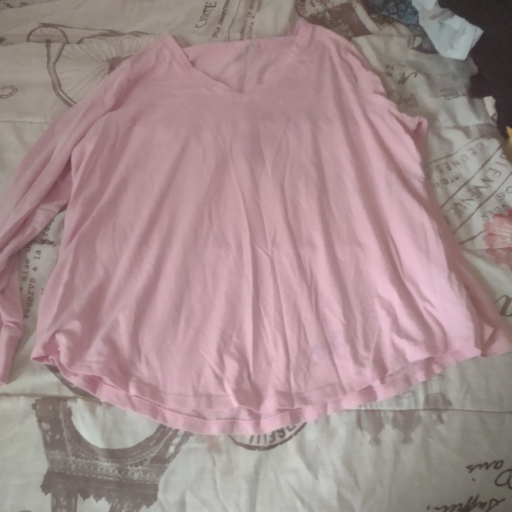 a pink long sleeve shirt